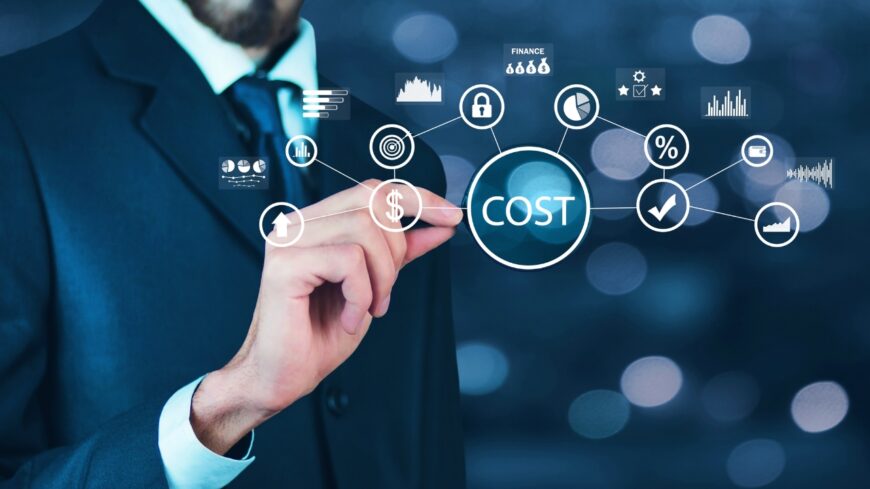 Businessman points at cost icons on screen, showing how basic maths shapes product pricing and profit